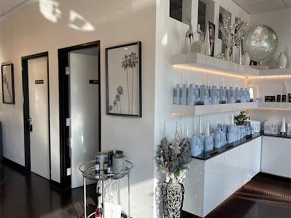 Finished commercial interior with display shelves and private rooms