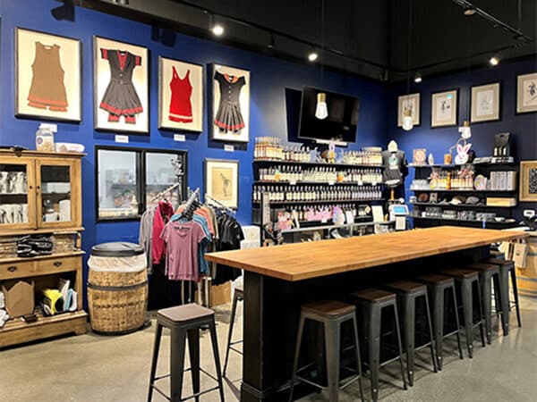 Finished tasting room with merchandise displays and communal table