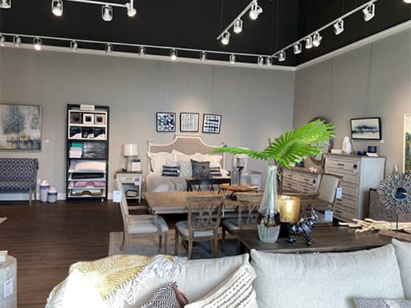 Furnished retail showroom with track lighting and display areas