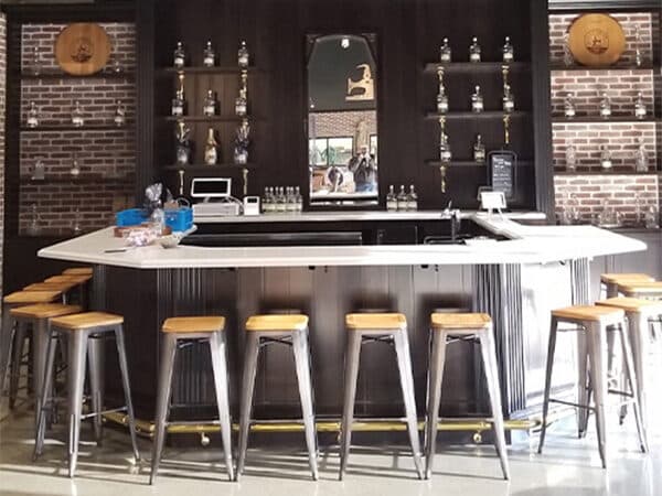 Completed commercial bar with brick walls and counter seating