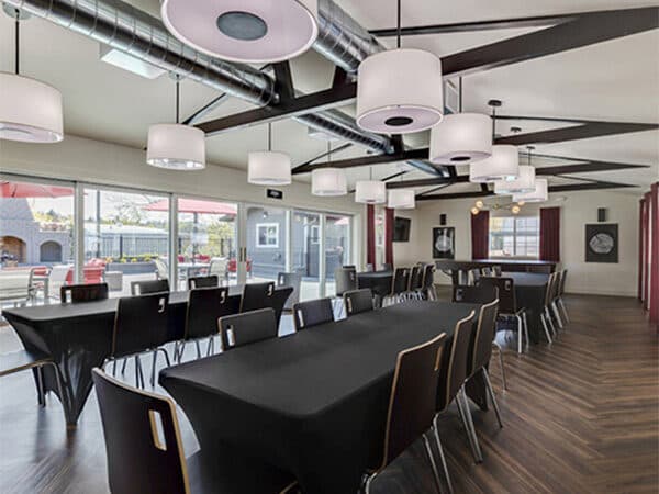 Clubhouse event room arranged with tables and chairs